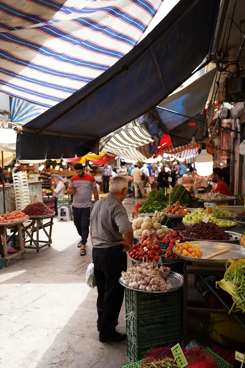 people shopping at a farmers market
